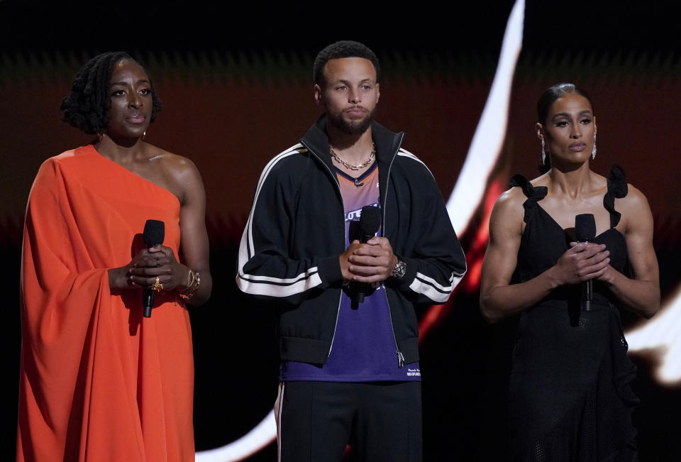 WNBA player Nneka Ogwumike of the Los Angeles Sparks, host Stephen Curry, and WNBA player Skylar Diggins-Smith of the Phoenix Mercury speak about Brittney Griner's detainment at the ESPY Awards on Wednesday, July 20, 2022, at the Dolby Theatre in Los Angeles. (AP Photo/Mark Terrill)