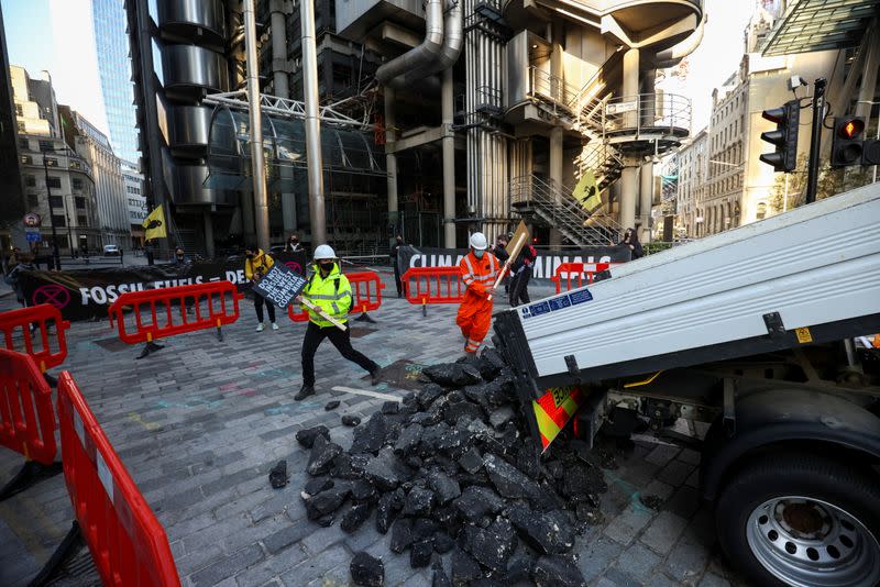 Extinction Rebellion activists protest outside the Lloyd's building in London