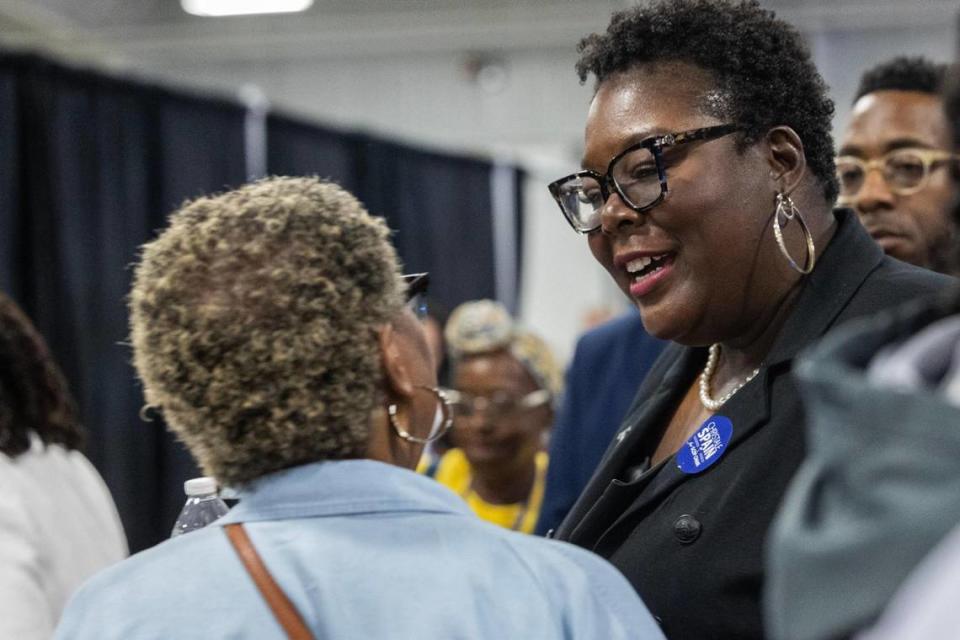 Christale Spain speaks with delegates before the South Carolina Democratic Party convention on Saturday, April 29, 2023.