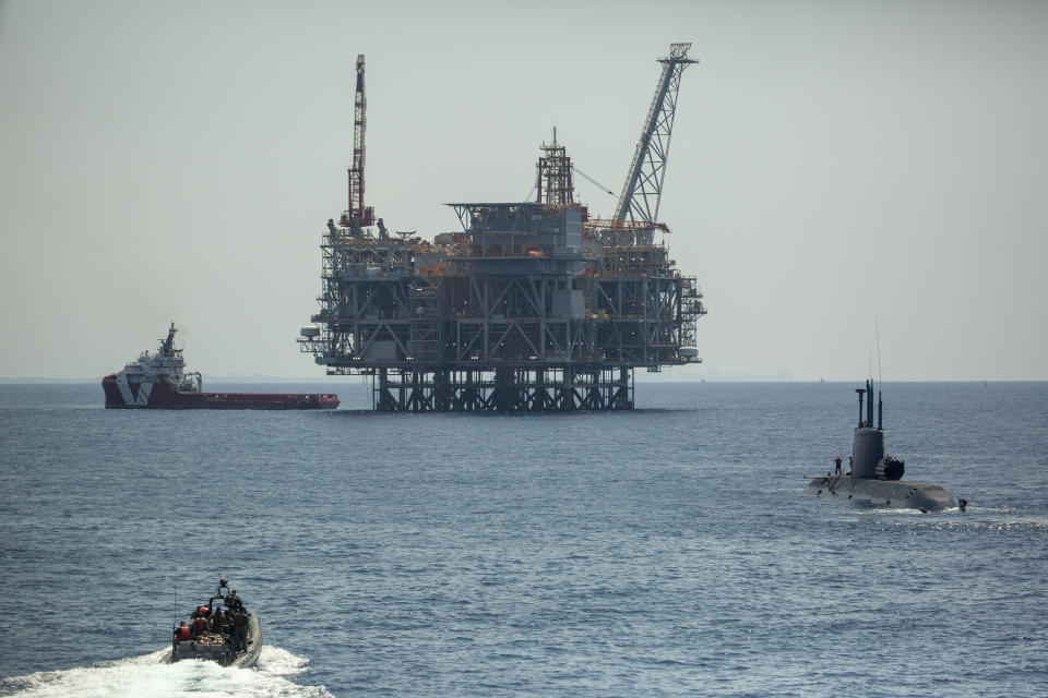 An oil platform in Israel's offshore Leviathan gas field is seen from on board the Israeli Navy Ship Atzmaut as a submarine patrols, in the Mediterranean Sea, Wednesday, Sept. 1, 2021. One of the navy’s most important responsibilities is protecting Israel’s natural gas platforms in the Mediterranean Sea, which now provide some 75% of the country’s electricity. (AP Photo/Ariel Schalit)