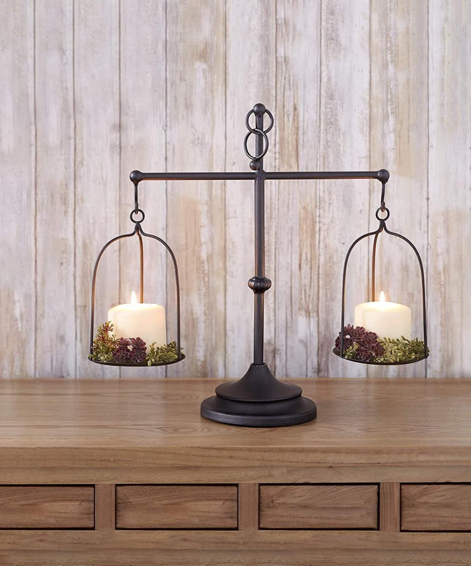 This candleholder will definitely be the center of attention &mdash; it's vintage-inspired and sure to make a statement. And everything looks better by candlelight anyway. <a href="https://amzn.to/3jb4wIr" target="_blank" rel="noopener noreferrer">Find it for $17 at Amazon</a>.