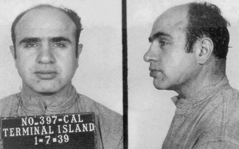 A police mugshot of Al Capone from 1939, with a frontal shot and profile