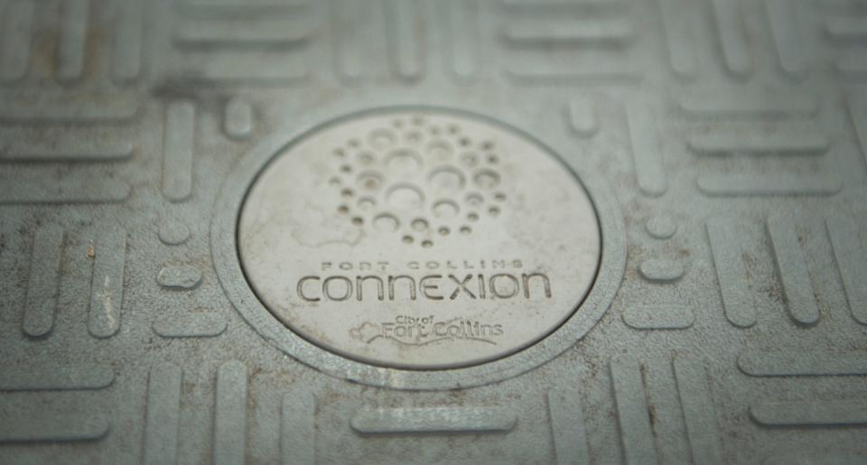 The logo for Fort Collins Connexion is visible on a cover for a network access point in a neighborhood serviced by the company in Fort Collins, Colo. on Thursday, Jan. 21, 2021.