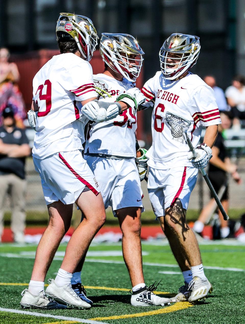 From left, BC High's Tim Rogers, Will Emsing and James Carroll celebrate a goal during a game in the Division 1 state tournament against Newton South on Wednesday, June 8, 2022.
