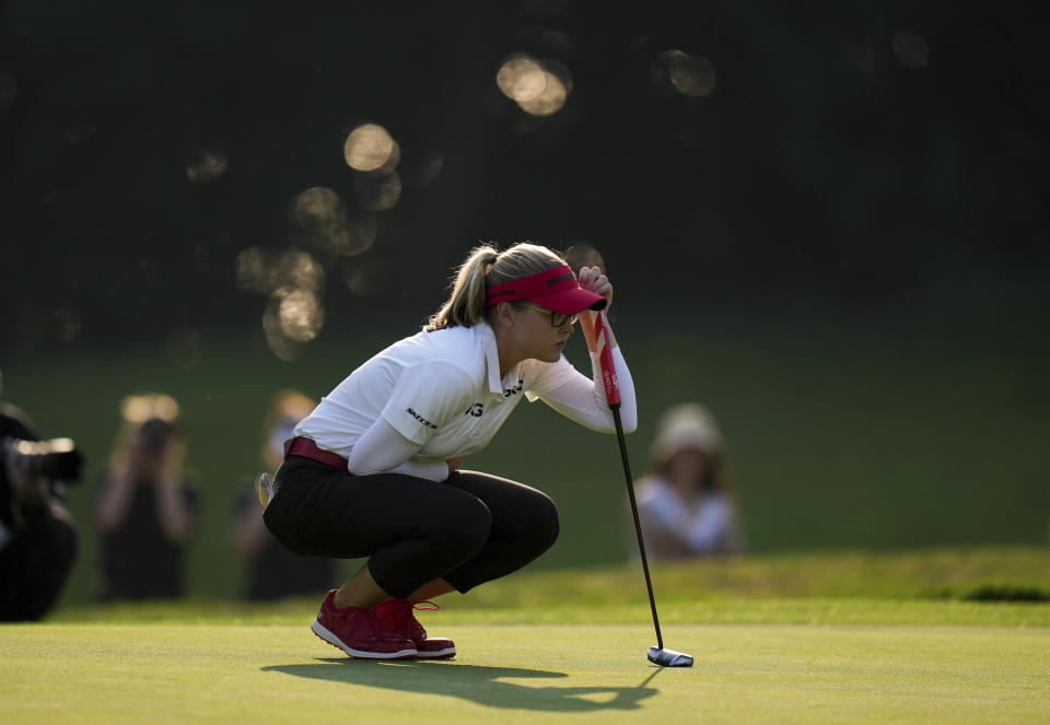 Brooke Henderson, of Canada, lines up a putt on the 17th hole during the third round at the LPGA CPKC Canadian Women's Open golf tournament in Vancouver, British Columbia, Saturday, Aug. 26, 2023. (Darryl Dyck/The Canadian Press via AP)