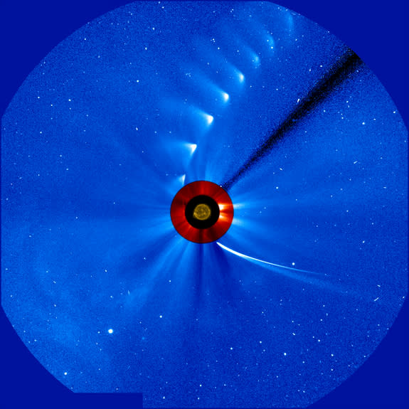 Comet ISON comes in from the bottom right and moves out toward the upper right, getting fainter and fainter, in this time-lapse image from the ESA/NASA Solar and Heliospheric Observatory on Nov. 28, 2013. The image of the sun at the center is f