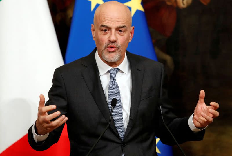 FILE PHOTO: Italian oil major Eni's CEO Descalzi gestures during a news conference to present an agreement on research in alternative fuels and carbon-cutting technologies in Rome