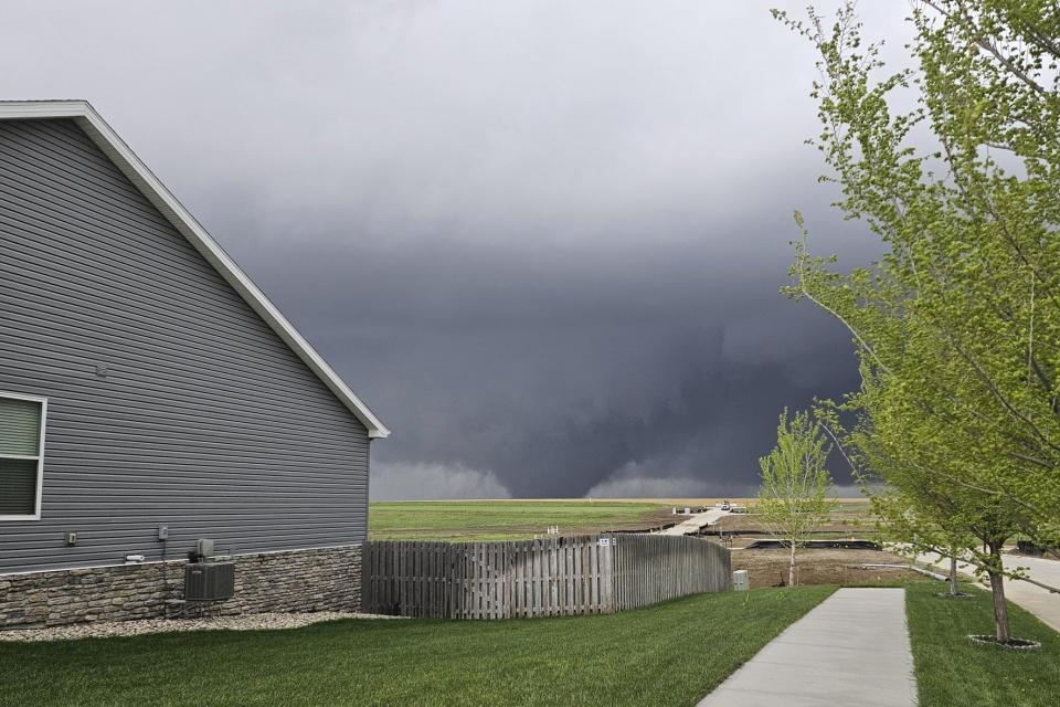 A tornado moves through suburbs northwest of Omaha on Friday, April 26, 2024, as seen from Bennington, Neb. (Chris Gannon via AP)