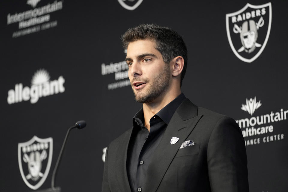 Las Vegas Raiders quarterback Jimmy Garoppolo takes questions at a, NFL football news conference Friday, March 17, 2023, in Henderson, Nev. (AP Photo/John Locher)