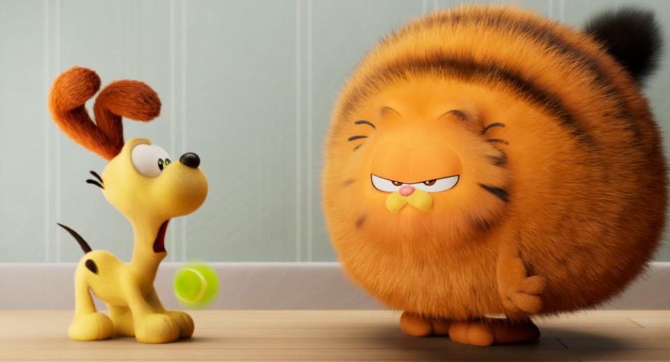 Odie and Garfield (voiced by Chris Pratt) in 2024's "The Garfield Movie."