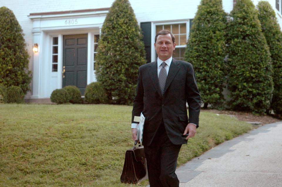 Supreme Court nominee John Roberts leaves his house on Tuesday, Sept. 6, 2005, in Chevy Chase, Md.