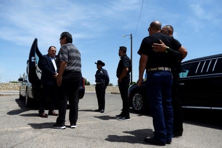 FILE PHOTO: Friends and family gather for a funeral, six days after a mass shooting in El Paso