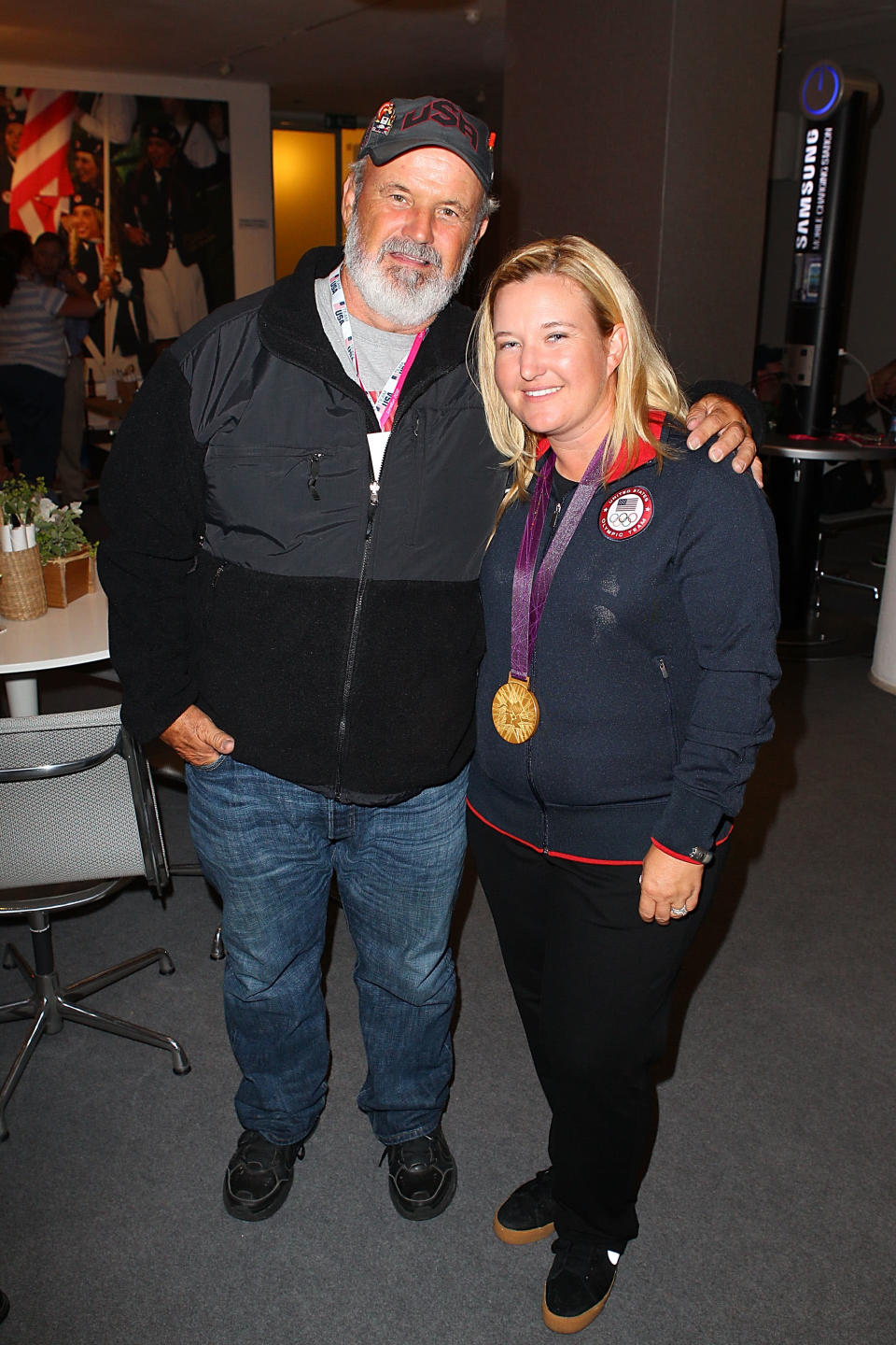 U.S. Olympic gold medalist Kimberly Rhode stops for a photo with her father Richard Rhode at the USOC Function at the USA House at the Royal College of Art on July 29, 2012 in London, England. (Photo by Joe Scarnici/Getty Images)