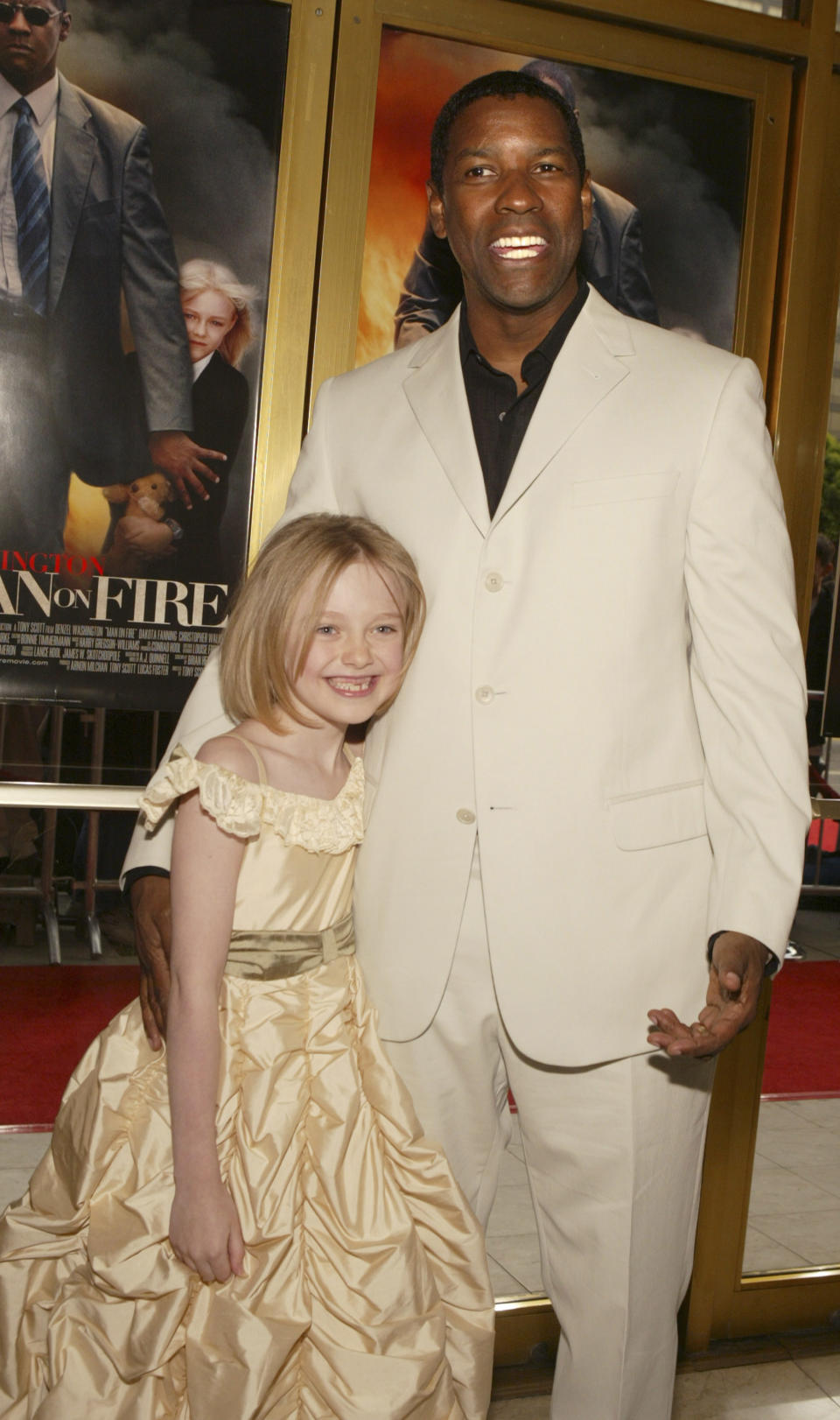 Dakota Fanning and Denzel Washington at the Man on Fire premiere in 2004. 