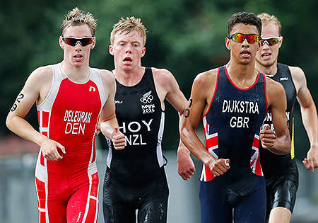 (L-R) Deleuran Hansen of Denmark, Daniel Hoy of New Zealand, Ben Dijkstra of Great Britain and Peer Sonksen of Germany compete in the running stage during the Men's Triathlon on day two of Nanjing 2014 Summer Youth Olympic Games.