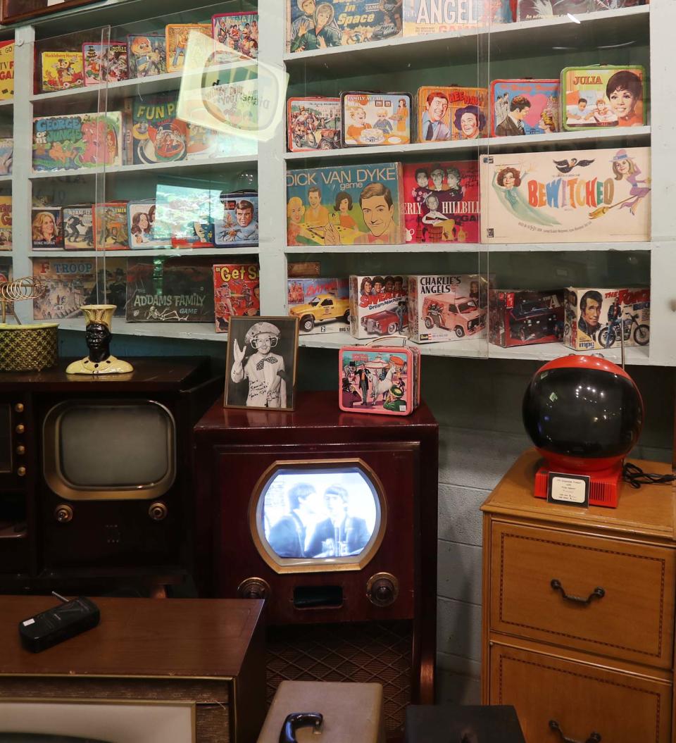 Televisions, board games and lunchboxes from the mid-20th century are sold at The Bomb Shelter in Akron.
