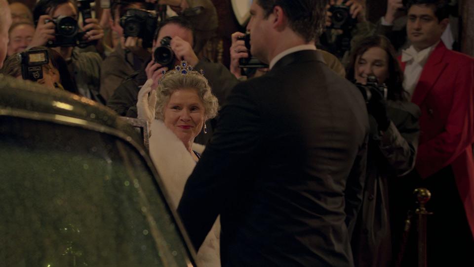 Imelda Staunton as Queen Elizabeth II steps out of car in The Crown