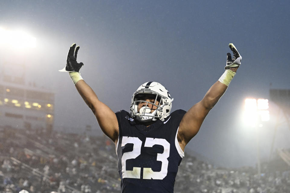 Penn State running back Trey Potts (23) celebrates a touchdown during the second half of an NCAA college football game against Massachusetts, Saturday, Oct. 14, 2023, in State College, Pa. (AP Photo/Barry Reeger)