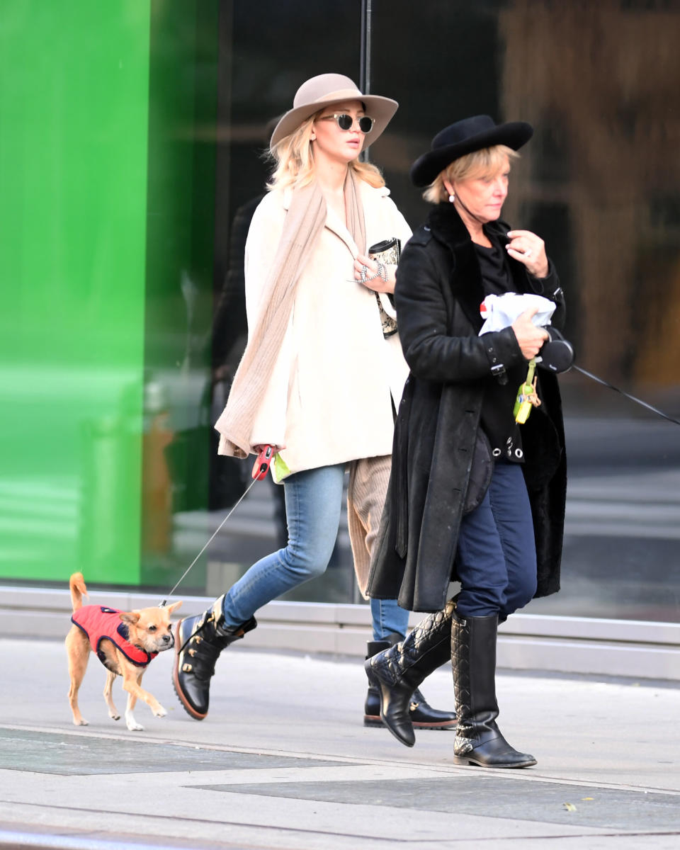 <p>J.Law and her mom, Karen, took a post-holiday stroll with their pups and strikingly similar ensembles in New York City. (Photo: Splash News) </p>