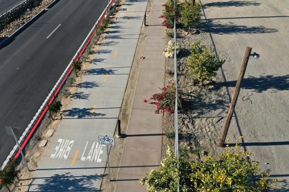 A walking and biking path along Grapefruit Boulevard is visible in Coachella, Calif., on Thursday, December 8, 2022. As part of the city's recent 'Urban Greening and Connectivity Project,' hundreds of trees and plants were installed between Ninth Street and Leoco Lane. 
