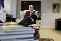 Panama Canal Administrator, Jorge Quijano gestures as he speaks during an interview with Reuters in Panama City March 24, 2015. REUTERS/Carlos Jasso