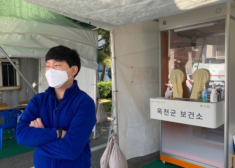 Nam Ha-jong, a public health doctor serving a 36-month duty after medical school as part of the country's conscription instead of regular military service, works at a coronavirus testing clinic in Okcheon