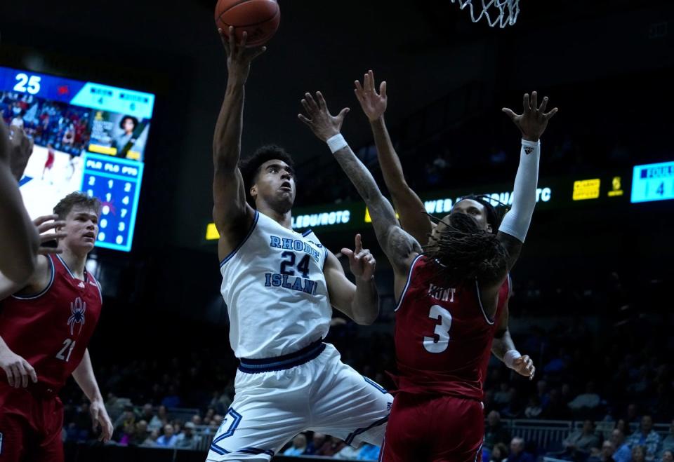 URI forward David Fuchs goes up to the basket against multiple Richmond defenders for a first-half score.