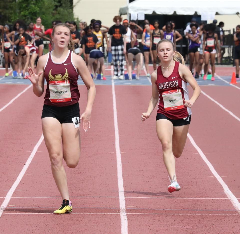 Riley Pettigrew from Arlington and other athletes compete in the women's 100 meter dash during the 55th annual Glenn D. Loucks Track & Field Games at White Plains High School, May 13, 2023. 