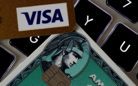 Visa and American Express credit cards on a computer keyword - Credit: Philippe Wojazer/Reuters