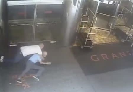 Ex-tennis star James Blake is shown tackled by a NYPD officer James Frascatore (L) in front of the Grand Hyatt hotel in New York on September 9, 2015 in this still image from a security camera video released on September 11, 2015. REUTERS/NYPD/Handout