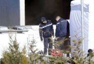 French gendarmes and investigators are seen at work in Seyne-les-Alpes near the crash site of the Airbus A320, in French Alps March 27, 2015. REUTERS/Jean-Paul Pelissier