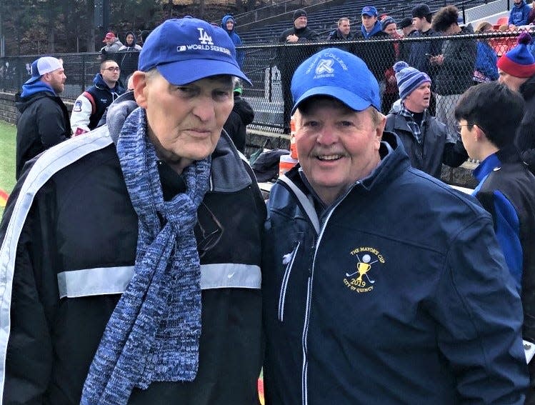 Lloyd Hill Sr. with Quincy College Athletic Director Jack Raymer in 2019. They are at Veterans Memorial Stadium in Quincy on Thanksgiving Day.
