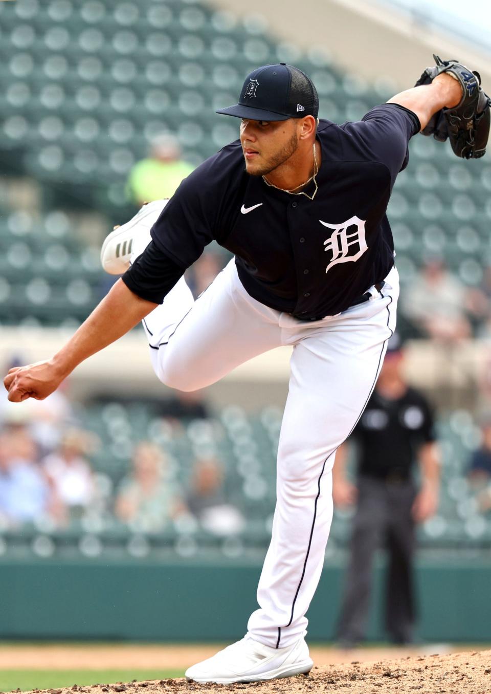 Tigers pitcher Joe Jimenez (77) throws a pitch during the fourth inning against the Yankees during spring training March 24, 2022 at Publix Field at Joker Marchant Stadium in Lakeland, Florida.