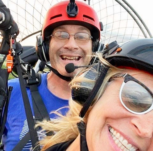 The late Jeff Chorba, pictured here paramotoring with longtime friend Karen Mander, was taken not long before his tragic death due to an accident near Beach Lake.