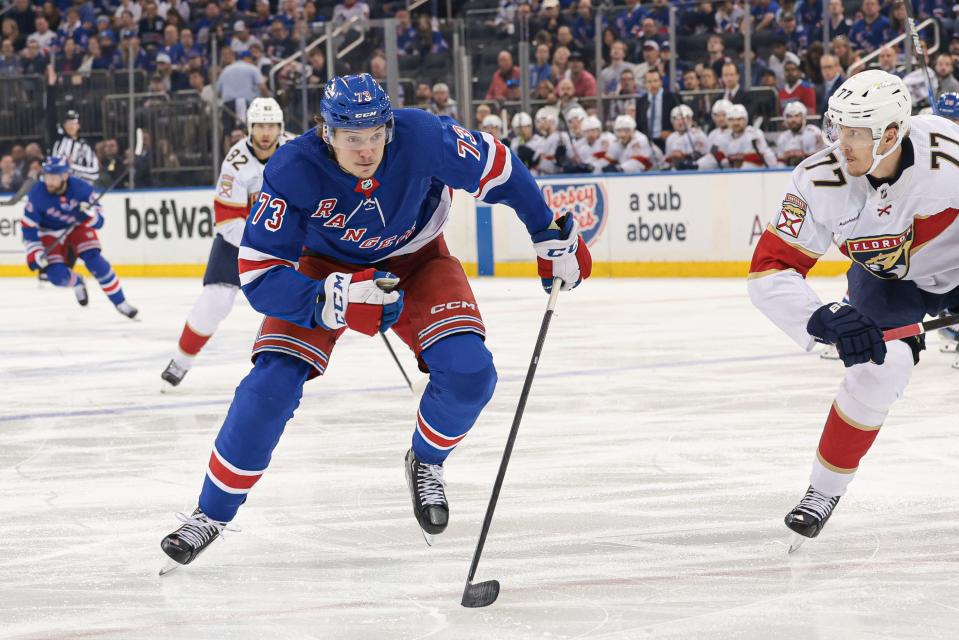 May 24, 2024; New York, New York, USA; New York Rangers center Matt Rempe (73) skates up ice as Florida Panthers defenseman Niko Mikkola (77) defends during the second period in game two of the Eastern Conference Final of the 2024 Stanley Cup Playoffs at Madison Square Garden.