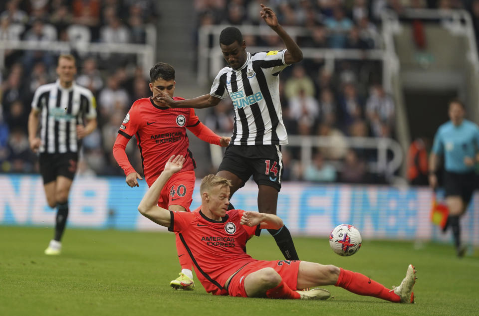 Newcastle United's Alexander Isak, right, and Brighton and Hove Albion's Jan Paul van Hecke battle for the ball during the English Premier League soccer match between Brighton and Hove Albion and Newcastle United at St. James' Park, Newcastle, England, Thursday May 18, 2023. (Owen Humphreys/PA via AP)