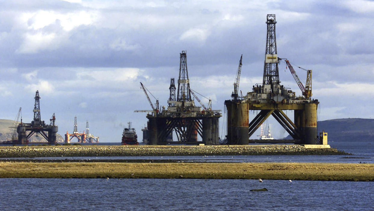 FILE - North sea oil exploration platforms lie in the Cromerty Firth in northern Scotland on March 2, 2003. British regulators on Wednesday, Sept. 27, 2023, approved new oil and gas drilling in the North Sea, a move environmentalists say will hurt the country’s attempt to meet its climate goals. (AP Photo/Martin Cleaver)