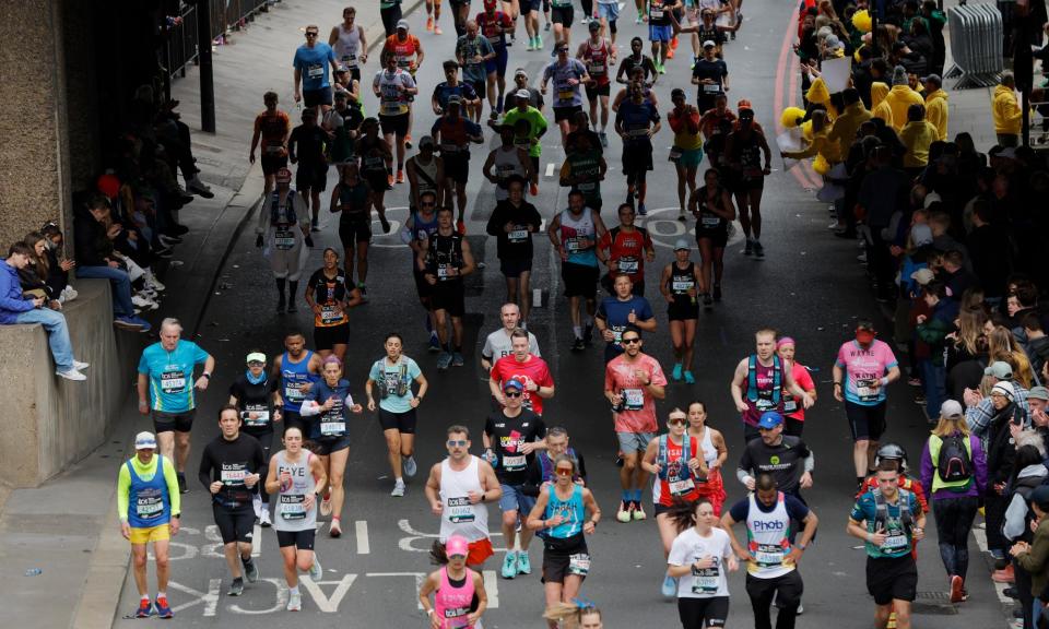 <span>Runners heading west on Upper Thames Street in the closing stages of the race.</span><span>Photograph: Tom Jenkins/The Guardian</span>