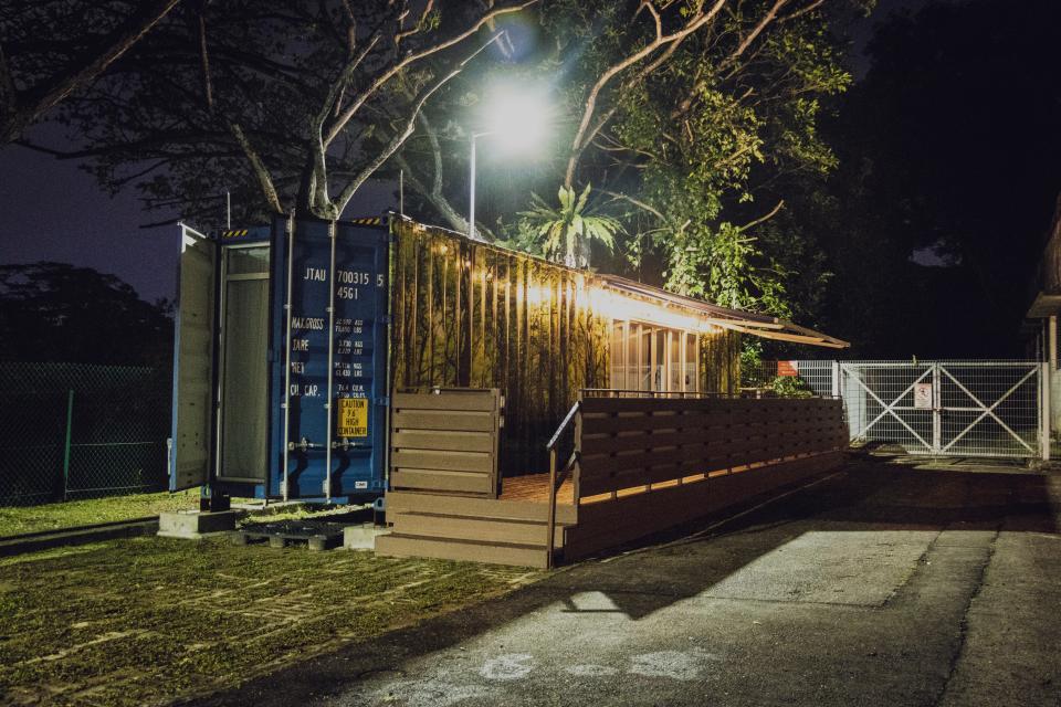 The Shipping Container Hotel at night.
