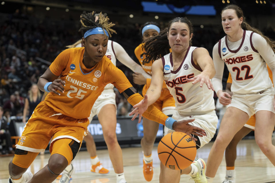 Virginia Tech guard Georgia Amoore (5) and Tennessee guard Jordan Horston (25) scramble for a loose ball during the second half of a Sweet 16 college basketball game of the NCAA Tournament, Saturday, March 25, 2023, in Seattle. Virginia Tech won 73-64. (AP Photo/Stephen Brashear)