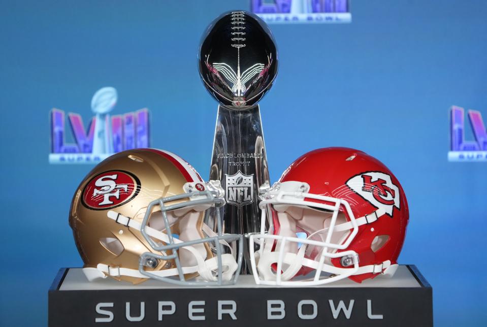 Feb 5, 2024; Las Vegas, NV, USA; Helmets for the San Francisco 49ers and Kansas City Chiefs on display with the Vince Lombardi Trophy before NFL commissioner Roger Goodell speaks at a press conference in advance of Super Bowl LVIII between the Kansas City Chiefs and San Francisco 49ers at Allegiant Stadium. Mandatory Credit: Kirby Lee-USA TODAY Sports