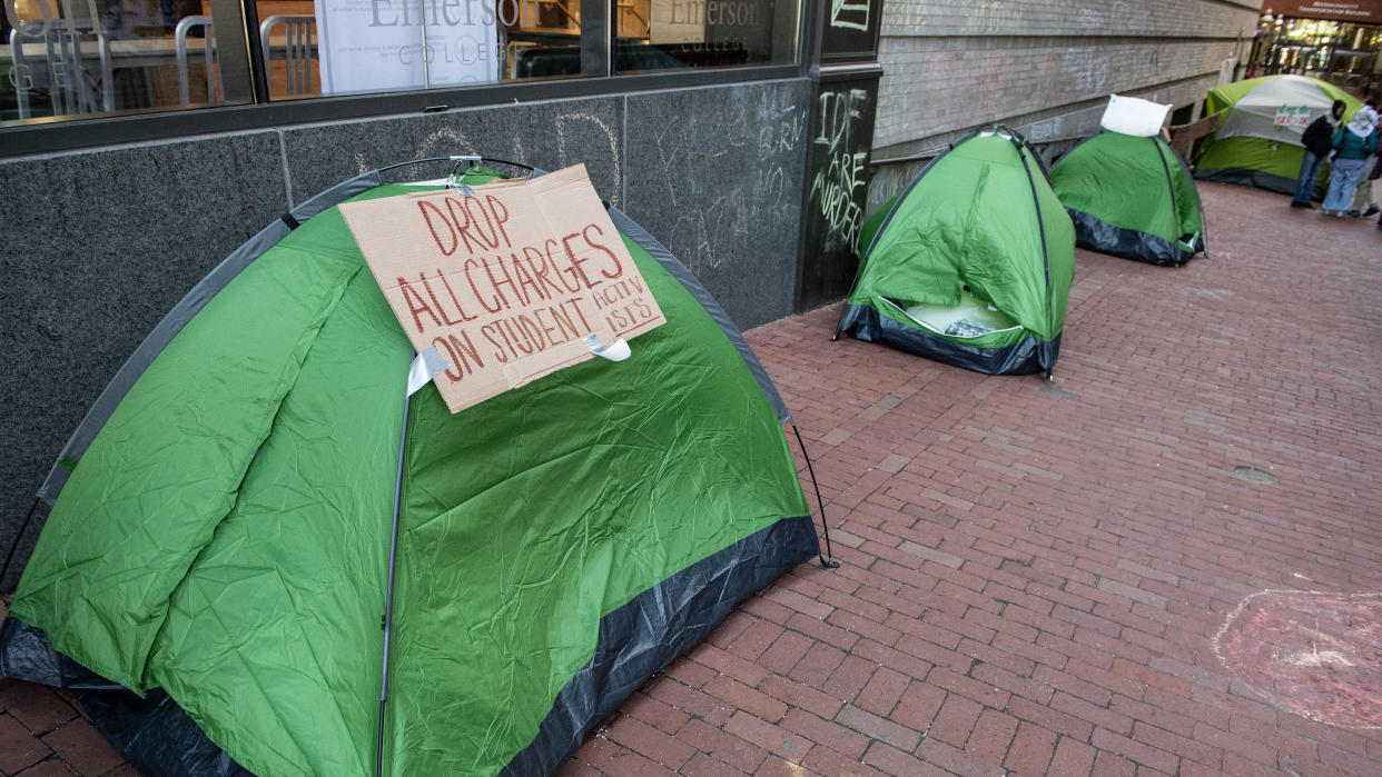 Students at Emerson College supporting Palestine sleep in tents in an alley off of Boylston street in Boston on April 22, 2024.  / Credit: JOSEPH PREZIOSO/AFP via Getty Images