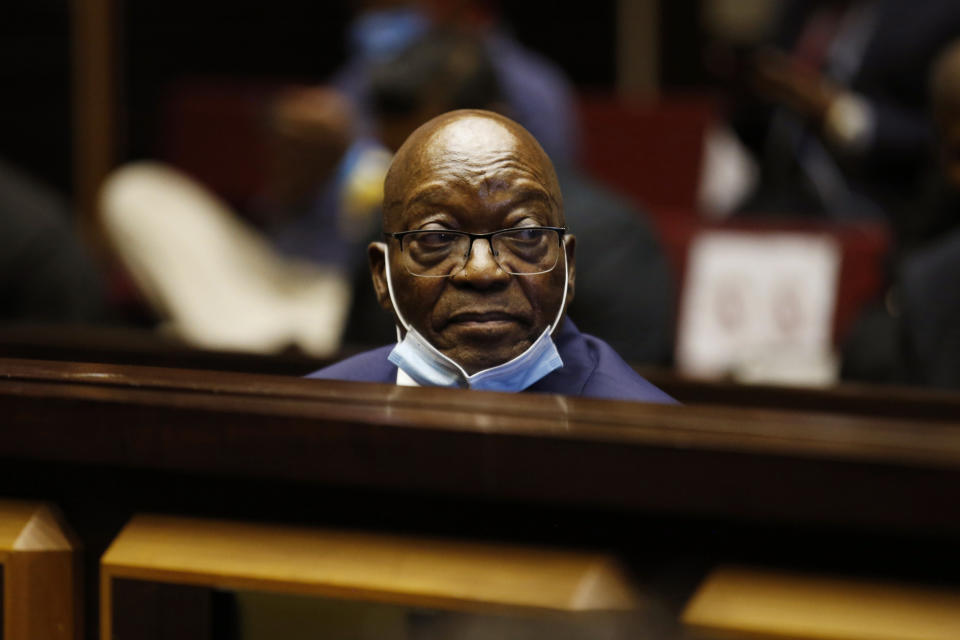 FILE — Former South African President Jacob Zuma, sits in the High Court in Pietermaritzburg, South Africa, Wednesday May 26, 2021, at the start of his corruption trial. Judgement handed down Tuesday, June 29, 2021 in the Constitutional Court, has found Zuma guilty of contempt of court, and sentenced him to 15 months of direct unsuspended imprisonment. (Phill Magakoe/Pool Photo via AP)