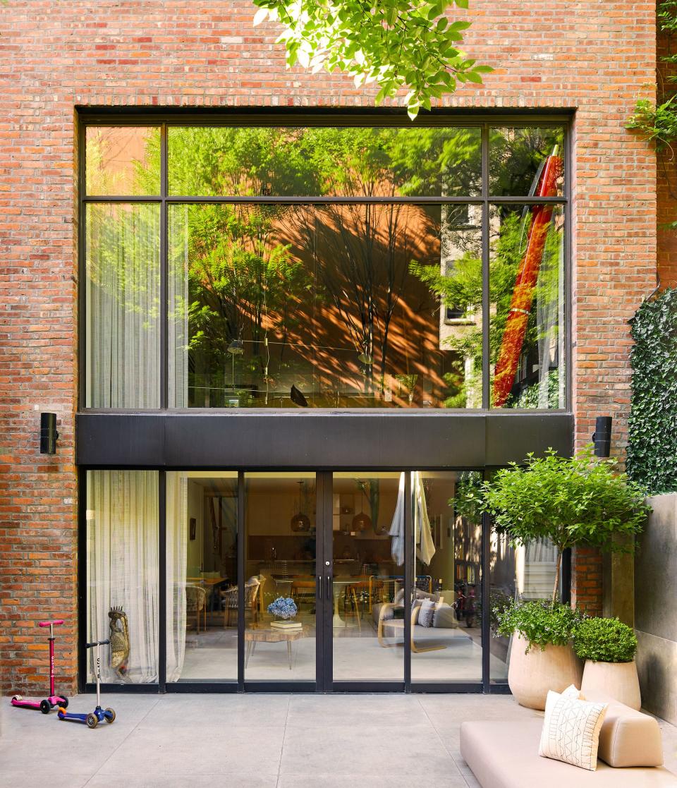 Verhoeven and her husband searched for years to find the perfect townhouse with an old, traditional exterior yet contemporary architecture inside, and it turned out to be one of the first they saw, this circa-1899 home in the West Village, with a spacious private backyard featuring living walls and a pair of hornbeam trees.