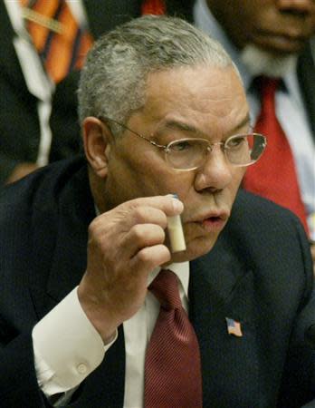 U.S. Secretary of State Colin Powell holds up a vial that he described as one that could contain anthrax, during his presentation on Iraq to the U.N. Security Council, in New York in this February 5, 2003 file picture. REUTERS/Mike Segar