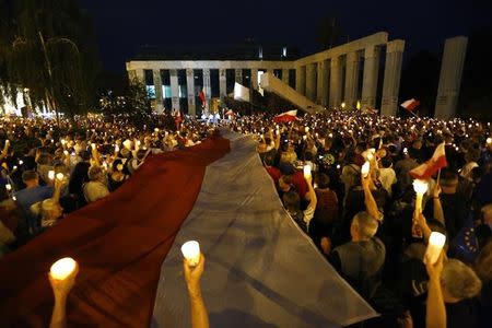 People attend a protest against judicial reforms in Warsaw, Poland, July 24, 2017. REUTERS/Kacper Pempel