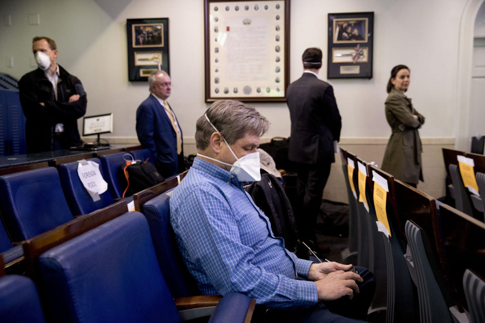 Members of the media wait in line to receive a test for COVID-19 by the White House Medical Unit before attending a news conference with President Donald Trump in the press briefing room at the White House, Thursday, April 9, 2020, in Washington. (AP Photo/Andrew Harnik)