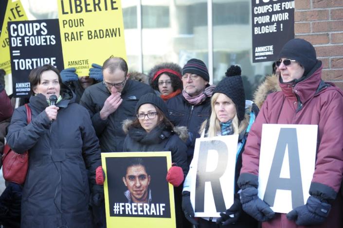 Ensaf Haidar (center), the wife of Saudi blogger Raef Badawi, is shown at a January 2015 vigil for her husband in Montreal, Quebec (AFP Photo/Clement Sabourin)