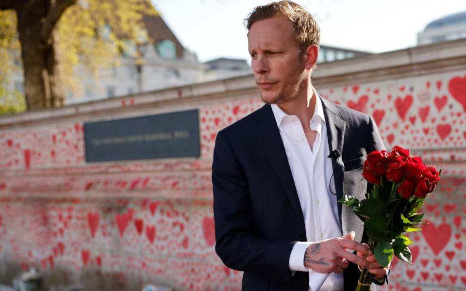 Fox arrives to lay a bouquet at the unveiling of a mural to highlight knife crime in London - Tolga Akmen/AFP