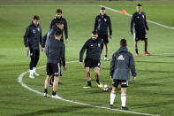 River Plate's goalkeeper Franco Armani, center, controls the ball during a training session in Madrid, Spain, Thursday, Dec. 6, 2018. The Copa Libertadores Final will be played on Dec. 9 in Spain at Real Madrid's stadium for security reasons after River Plate fans last Saturday attacked the Boca Junior team bus heading into the Buenos Aires stadium for the meeting of Argentina's fiercest soccer rivals. (AP Photo/Andrea Comas)